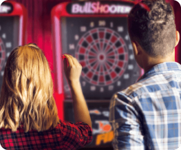 People playing darts